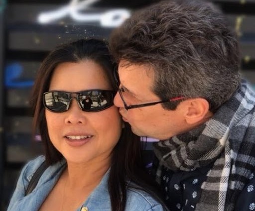 April Nocifora's brother, Perry Nocifora, kissing his wife, Oum Somkhit Nocifora.